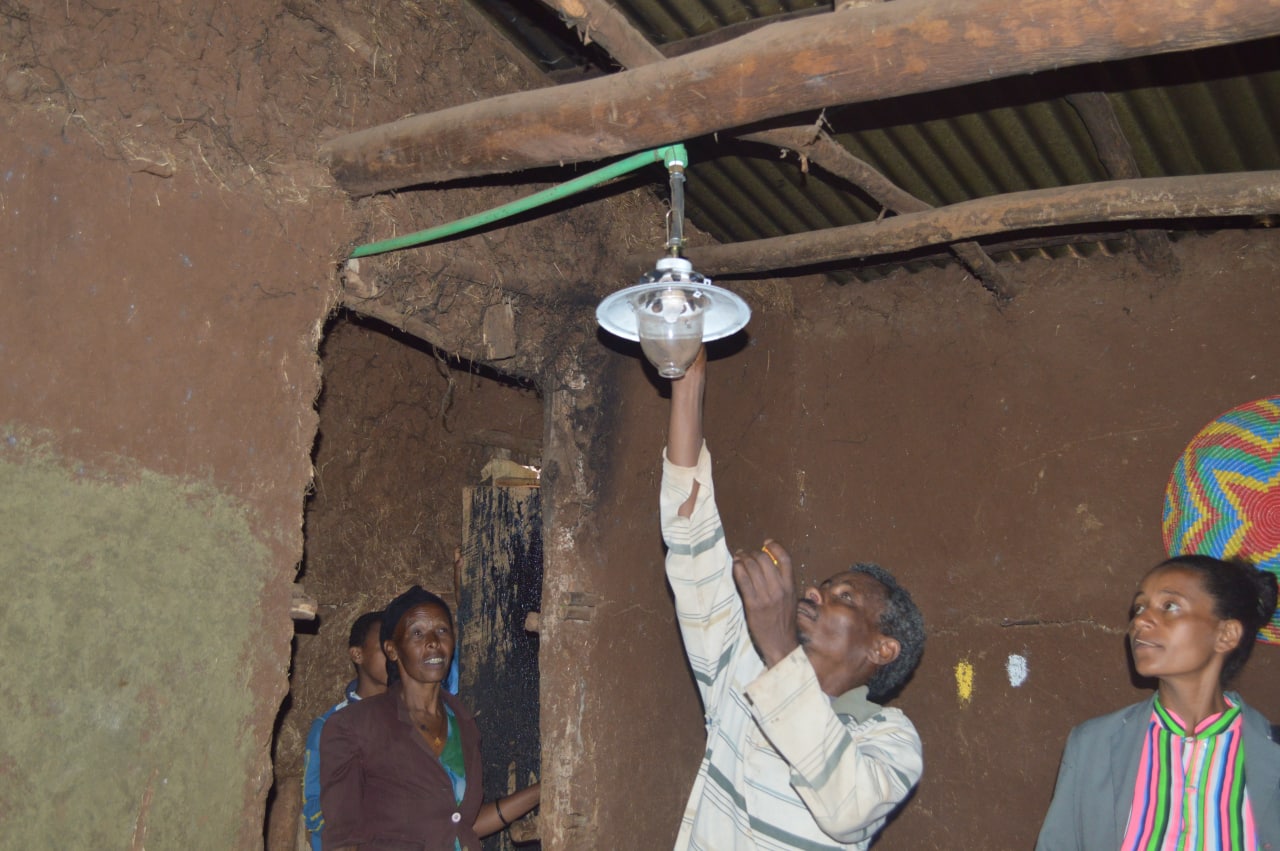 Man Fixing Light Bulb